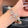 Pulsera de perlas con lazo de doble capa estilo vintage francés, diseño único y versátil, joyería de lujo ligero y de alta gama