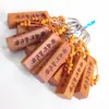 Llavero de coche de madera de melocotón, venta caliente, regalo de madera, colgante de llave de lugar escénico del templo Nanwu Amitabha