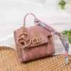 Mini Bolsa Encanto Llavero Billetera Estuche para Labial Auriculares Colgante Versátil para Bolso Bolsa de Almacenamiento para Llaves del Coche