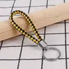 Llavero creativo llavero de cuerda de cuero cordón para llaves colgante de joyería cordón tejido fábrica de cuerda de cuero venta al por mayor