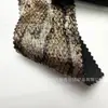 Tejido suave de terciopelo con estampado de pitón, repujado en dorado, de dos tonos y lavado, cómodo y con buena caída, adecuado para vestidos y ropa de actuación de danza.