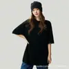Camiseta de cachemir minimalista y relajada de manga corta para mujer, silueta holgada, cuello redondo, top de punto versátil y favorecedor.