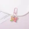 Chaveiro de resina borboleta cor de doce, estilo fofo e doce, pingente feminino, fornecimento para barracas de rua e feiras noturnas, atacado de acessórios de alta qualidade