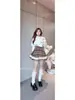 Conjunto Feminino Plus Size de Tricô com Gola Alta e Mangas Caídas, com Saia com Renda Xadrez Marrom, Modelador para Primavera e Outono