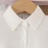 Conjunto de tres piezas para niñas de primavera y otoño, nuevo chaleco de punto + camisa blanca de manga larga + falda corta a cuadros, estilo preppy