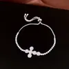 Pulsera de tipo jalador con colgante de cruz de zirconia, pulsera de lujo ligero de alta gama, pulsera de diseño de nicho de moda, accesorios de pulsera de nicho