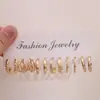 Set de Aretes de Moda Metálicos de Venta Caliente Transfronterizo Europeo y Americano con Elementos Creativos de Corazón Hueco y Aretes Geométricos Retorcidos