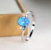 AliExpress nuevo anillo ovalado de cuatro garras personalidad simple nicho lujo ligero anillo elegante anillo entrega de una sola pieza