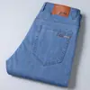 Atacado de roupas masculinas verão 2023 jeans macio masculino elástico tubo reto denim cintura de negócios tamanho grande calças largas