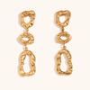 Aretes europeos y americanos de moda transfronteriza de venta caliente, geométricos huecos de acero inoxidable chapado en oro de 18 quilates, redondos irregulares con costuras de vórtice