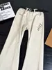 Jeans de algodón puro bordados color blanco roto cleanfit para hombre corte diagonal americano pierna curva pantalones high street pierna recta pantalones ligeramente acampanados
