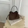 Bolso de Cubo con Cordón Retro de Nicho Otoño Invierno Nuevo Coreano de Lujo Ligero Versátil Casual para el Trabajo Bolso de Hombro Cruzado