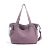 Nova bolsa de lona estilo japonês minimalista 2026, grande capacidade, bolsa de ombro casual, adequada para o trabalho e uso diário, com um design literário e artístico