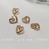 Hebilla de camisa con forma de corazón de metal botón de corazón de pierna alta botón de camisa suéter cárdigan botón hebilla decorativa dorada gemelos hebilla de cuello