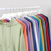 Atacado de fábrica solto grande ombro caído moda pulôver com capuz bolso suéter código europeu transfronteiriço casual cor sólida estampável