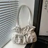 Personalidade descontraída bolsa de ombro única grande capacidade travessia de fronteira deslocamento feminino 2026 PU outono novo estilo popular moda bolsa tote