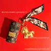 Venta al por mayor de Popular Llavero Colgante Monedero Cilíndrico Bolsa de Cuero Vintage Shuibei Oro Puro 999 Mafu