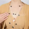 NK-283 trébol de cuatro hojas que gotea aceite 130 cm multicolor plegable cadena larga para suéter de mujer otoño e invierno nuevo venta al por mayor de fábrica