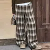 Conjunto de Moletom com Capuz Falso de Duas Peças e Calça Wide Leg Xadrez para Meninas Primavera e Outono 2026 Novo Estilo Conjunto Casual Coreano de Duas Peças para Crianças Pequenas e Grandes