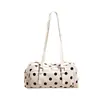 Bolso nuevo estilo retro para debajo del brazo, material de gamuza, adecuado para ir al trabajo, colección otoño 2026 para mujer, un bolso de hombro de lunares versátil y de nicho
