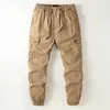 Calças camufladas largas para atividades ao ar livre em tamanhos grandes, com múltiplos bolsos, calças casuais estilo jogger masculinas, tamanho extra grande