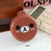 Pente de Almofada de Ar com Expressão de Urso Desenho Animado Fofo Estilo Japonês Cor Creme Pente Dobrável Portátil com Espelho e Escova de Massagem Integrada