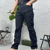 Pantalones tácticos para hombre de exportación transfronteriza del sudeste asiático para exteriores, con múltiples bolsillos, resistencia al desgaste, propiedades de secado rápido y adecuados para entrenamiento, montañismo, senderismo y trabajo.