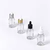 Em estoque Frasco de vidro transparente de 30ml com conta-gotas escalonado para base líquida, óleo essencial e sérum