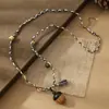 2026 Collar Retro de Cuerda Tejida a Mano con Cuentas de Acero de Titanio para Mujer Diseño de Nicho Estilo Étnico Cadena para Suéter Accesorios de Flor