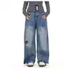 Jeans divertidos bordados estilo americano para hombres y mujeres, pantalones largos de otoño de moda callejera ligeramente acampanados con un diseño elegante y perneras anchas