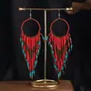 Joyas populares europeas y americanas fuente transfronteriza estilo étnico bohemio retro pendientes largos de borla de cuentas de arroz para mujer