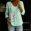 Nueva camisa estampada de cuello V abotonada de manga larga transfronteriza para mujer, elegante y con estilo para ir al trabajo, top casual único y moderno