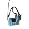 Bolso tipo cubo versátil y simple de verano, diseño de bolso tote de gran capacidad estilo fresco para el trabajo, nuevo bolso de hombro 2026