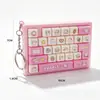 Mini teclado de 27 teclas llavero antiestrés de dibujos animados de mano para niños juguete de botones colgante antiestrés regalo pequeño transfronterizo venta al por mayor