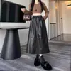 Saia Feminina de Couro PU Outono 2026 Versátil Elegante Moda Cintura Elástica Solta Comprimento Médio Linha A Saia Guarda-chuva