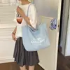 Nuevo modelo de mochila 2026, de doble cara, elegante, bolsa tipo tote de gran capacidad para estudiantes, adecuada para la escuela y los desplazamientos