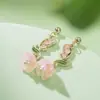 2026 Nuevo Estilo Caliente Flor de Lirio Aretes de Borla de Flor para Niña Cara Redonda Aretes Largos Ear Cuff Elegante