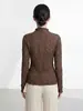 Top de mujer de alta gama Shenzhen Nanyou, elegante suéter irregular de color liso, camiseta base de manga larga ajustada estilo Issey Miyake