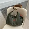 Bolsa de tela de moda casual 2025 Verano Nuevo Bolso Tote de Gran Capacidad Simple Bolso de Hombro Cruzado Bolso Ligero Versátil