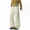 Pantalones deportivos negros para hombre con costuras de contraste, diseño cruzado, pierna ancha, cintura elástica con cordón, corte holgado, caída fluida, estilo deportivo, largo hasta el suelo para hombres jóvenes