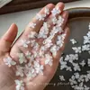 Decoraciones para uñas de flor de cristal de hielo tallada suave, modernas y versátiles, blanco translúcido, flor de cuatro pétalos tridimensional para decoración de uñas, pedrería de resina, al por mayor