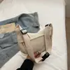Bolsa Transversal Simples de Grande Capacidade Estilo Japonês para Mulheres 2025 Verão Nova Bolsa de Ombro Pequena Estudante Bolsa Dumpling de Tecido para Mulheres