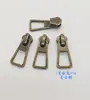 Cabezal de cremallera de fábrica en stock No. 3 No. 5 No. 8 cremallera de tirador inferior de metal bronce bronce bolsa con cremallera