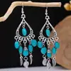 Brincos turquesa estilo étnico vintage europeu e americano, brincos pendentes de borla turquesa boêmios, brincos mais vendidos das áreas cênicas de Yunnan