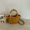 Bolso de un solo hombro Bolso de un solo hombro tejido con textura simple y elegante para mujer 2026 nuevo bolso tipo cubo cruzado de moda de verano