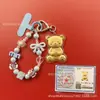 Llavero de tela con logo de empresa personalizado Cadena para teléfono móvil Angela Lámina de oro puro Oro 999 Regalo de aniversario