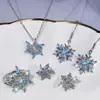 Traje de joyería clásica para boda anillo de copo de nieve pendientes de botón de circón azul para mujer traje de anillo de collar joyería transfronteriza europea y americana