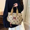 Atacado transfronteiriço nova bolsa de mão impermeável de tecido Oxford com bolinhas, bolsa para marmita, bolsa tote casual de nicho, bolsa para mamãe