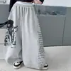 Conjunto de Camiseta de Hip-Hop de Moda para Niñas y Pantalones Anchos con Graffiti 2026 Nueva Moda Conjunto de Dos Piezas Elegante para Baile Callejero de Primavera y Otoño para Niños