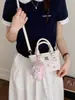 Bolso Cubo Estilo Japonés y Coreano con Estampado de Dibujos Animados para Mujer 2026 Nueva Moda Bolso de Hombro Cruzado Versátil para Viajes Casuales
